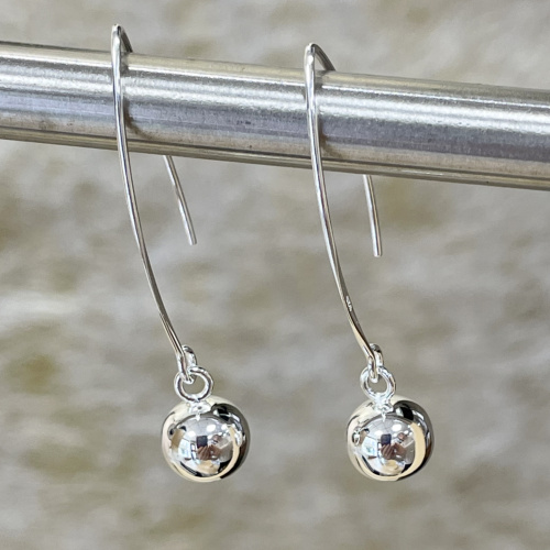 Sleek And Long Hook Earrings With A Silver Ball Drop